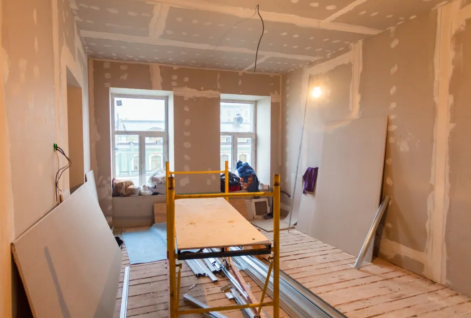 Room under renovation with construction materials.